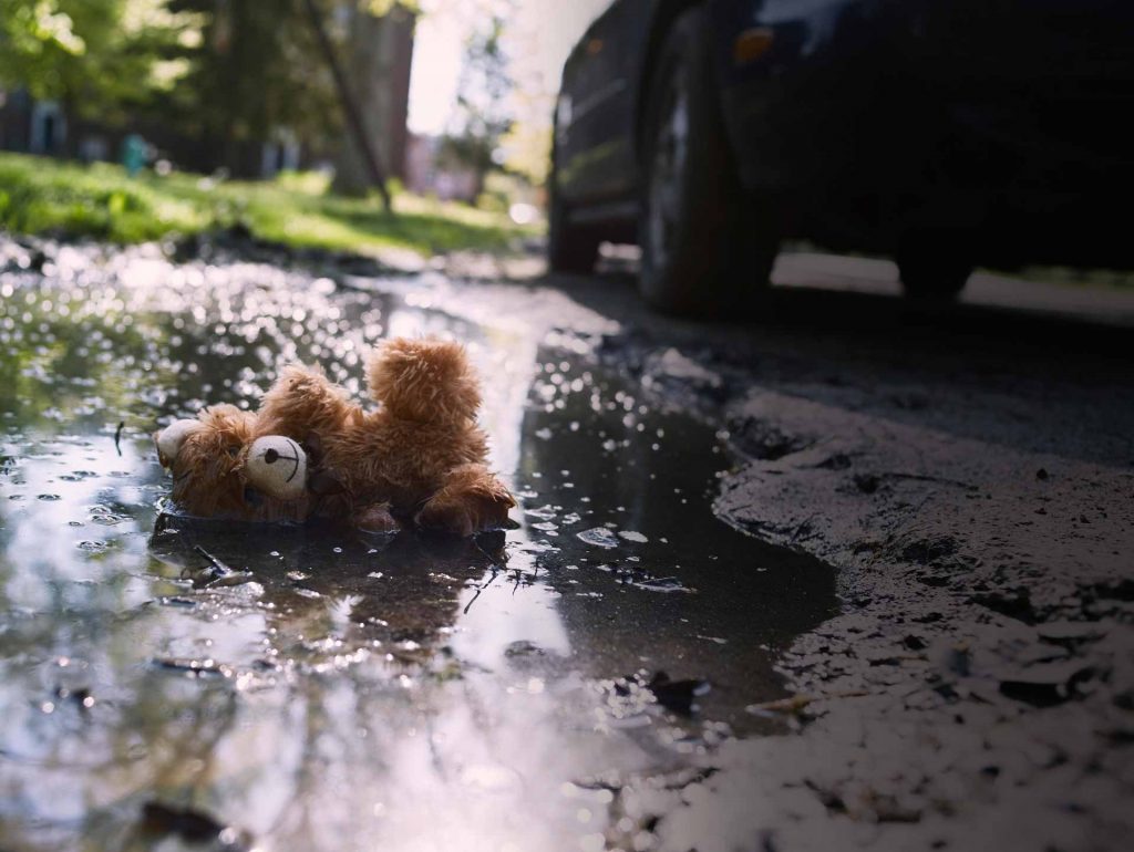 Teddy bear in driveway