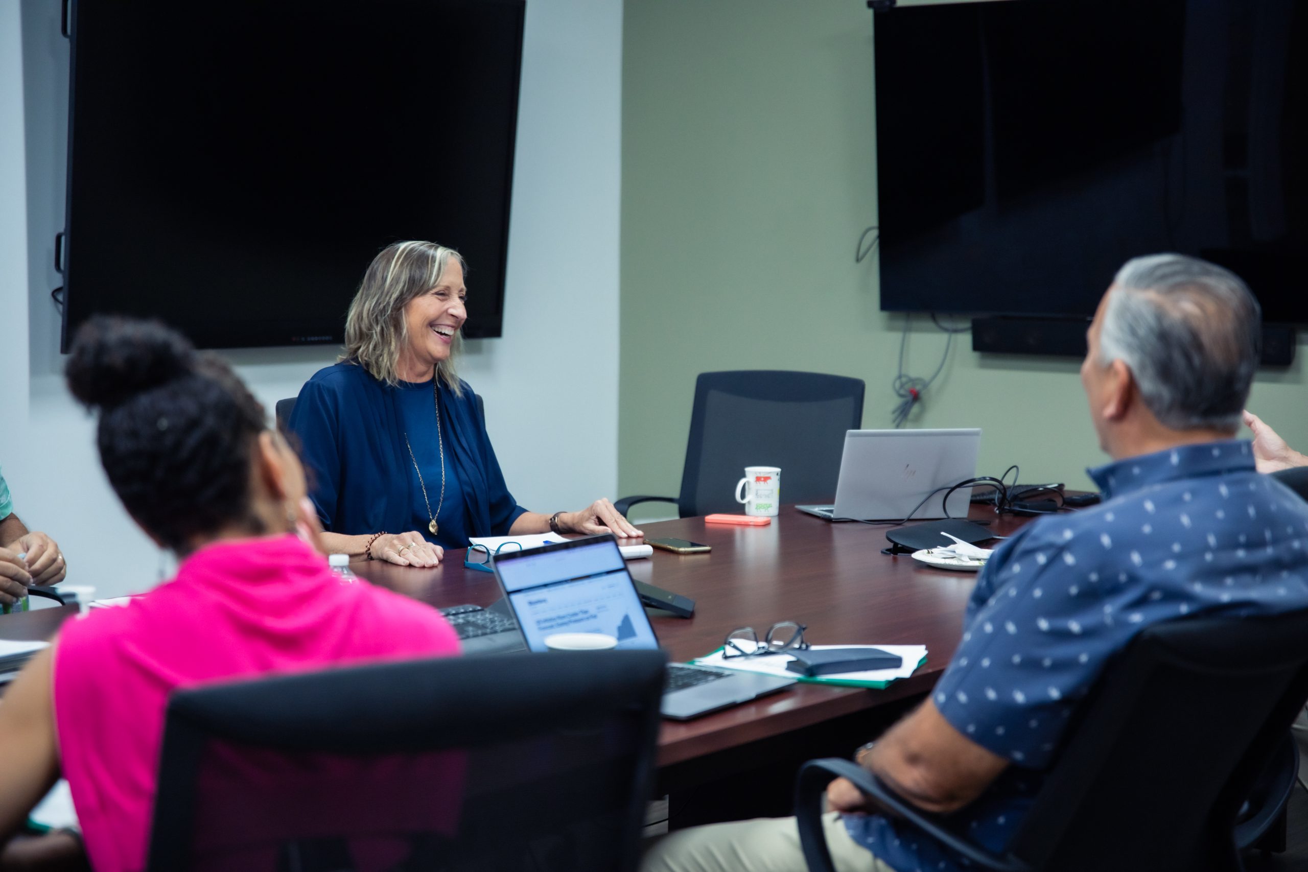 Lolly Colombo, Former BDI Chief Client Officer, in a meeting