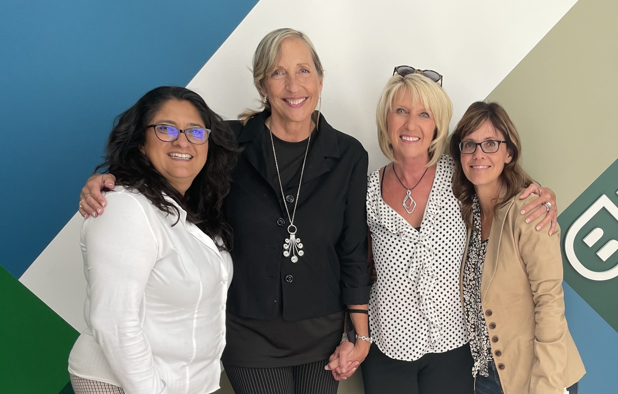 Lolly Colombo, Former BDI Chief Client Officer, in a meeting with other BDI team members